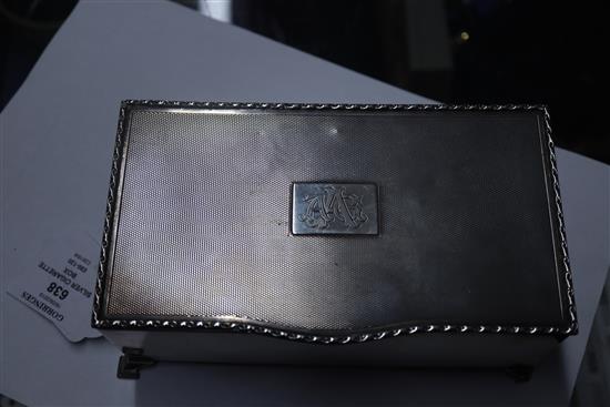 A 1930s silver cigarette box, with engine turned lid, 17.3cm.